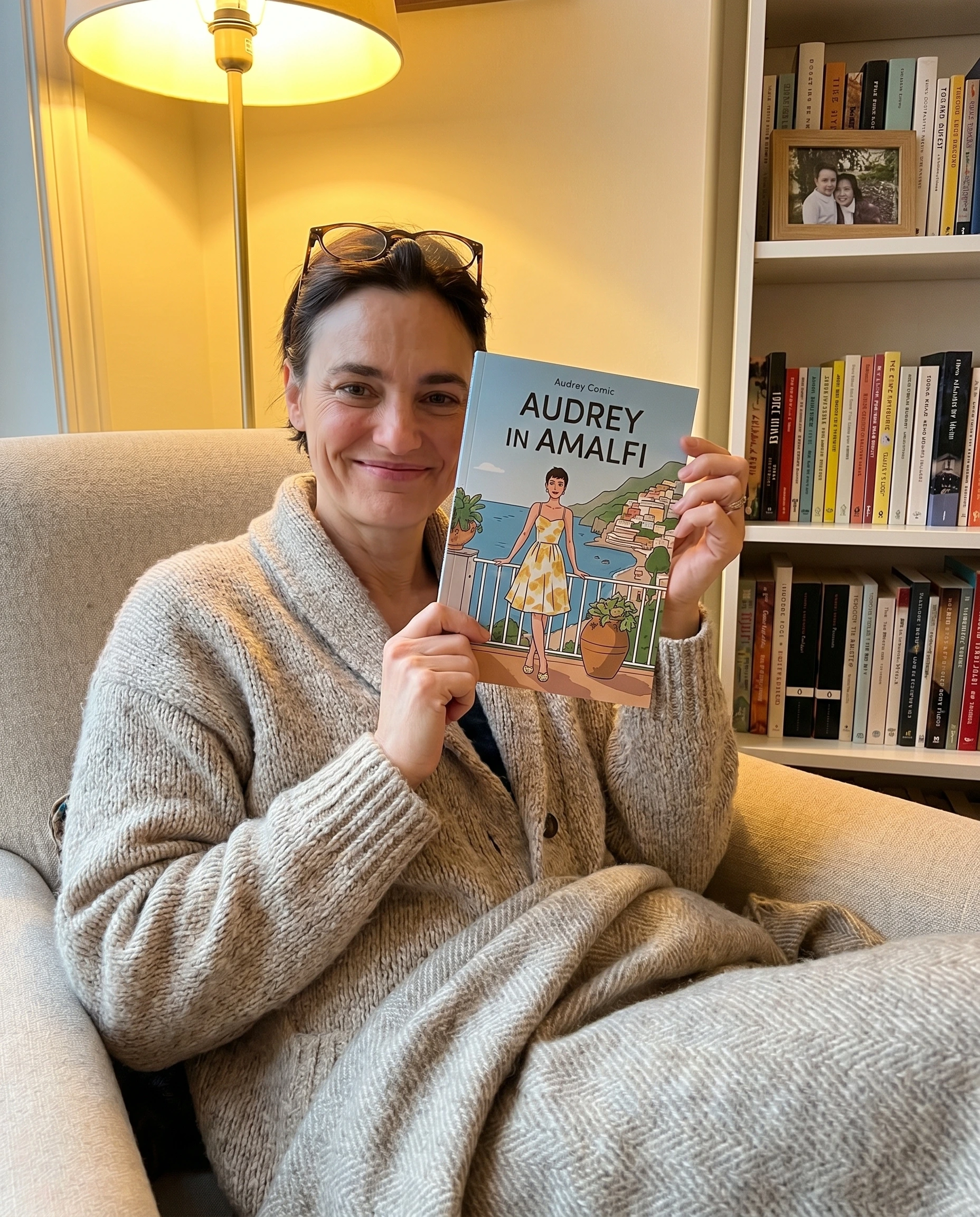Audrey M. holding their printed comic